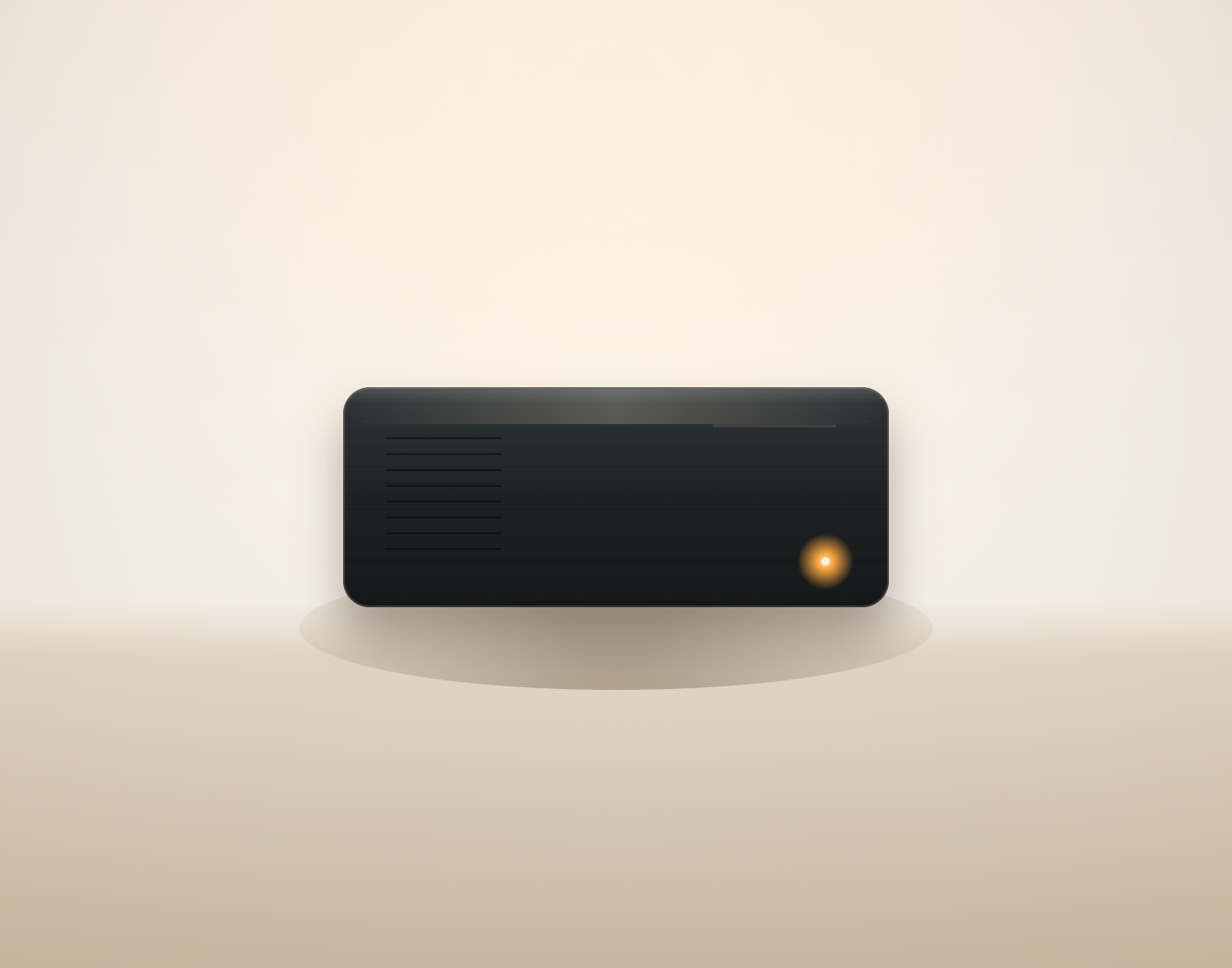A compact black aluminum mini-PC, preconfigured by ITCOM Solutions as a plug-and-play Stremio streaming server, shown as a clean product render on a warm neutral background.